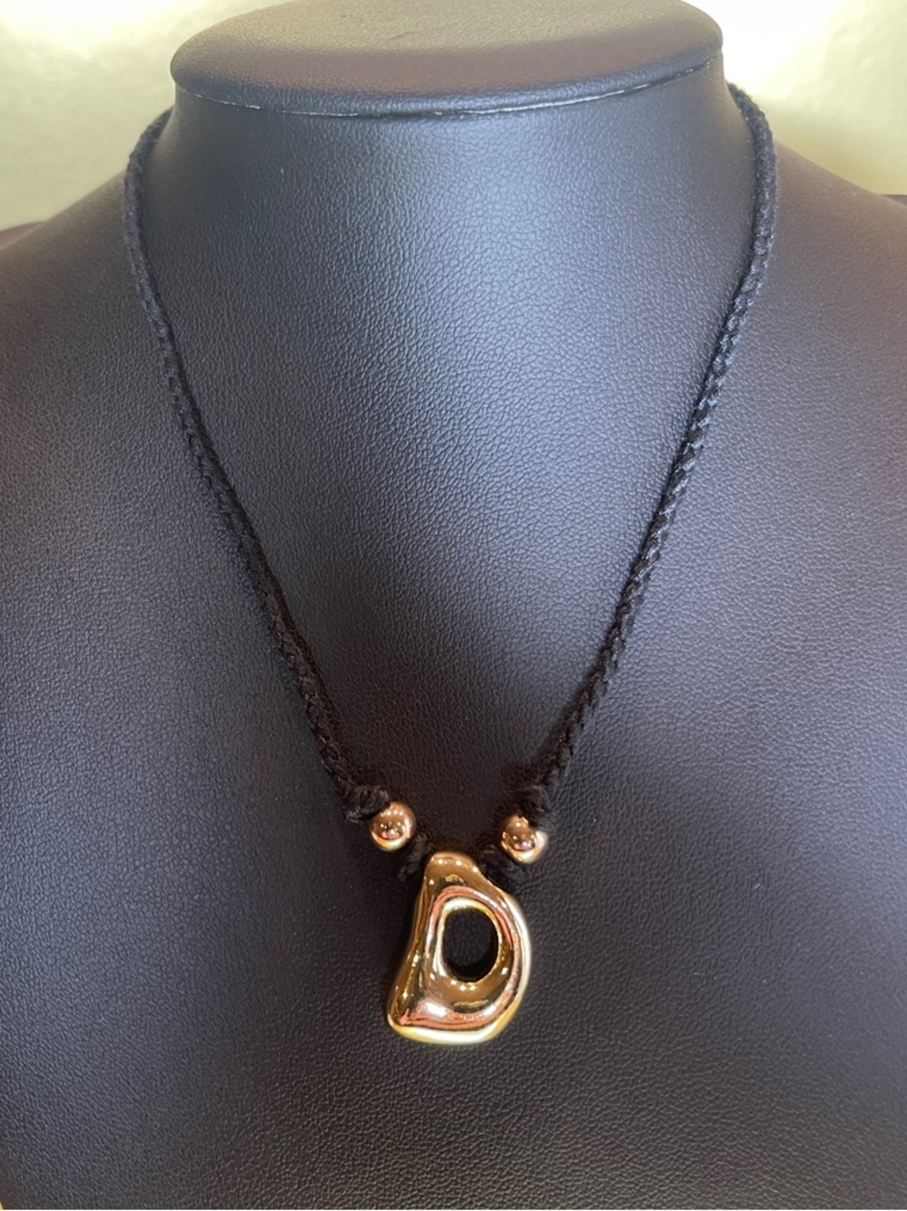 Gold Sculptural D Pendant Necklace on Black Braided adjustable Cord